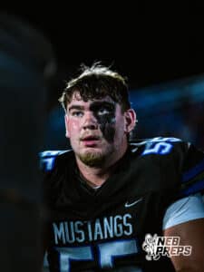 Millard North's Nate Maraable (55) focused on the game while on the sideline during a high school football game against Omaha Central on Friday, October 17, 2025, in Omaha, Nebraska. Photo By Jack Stephens.