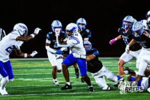 Omaha Central's Kylonn Haynie (8) running through traffic to get the first down during a high school football game at Millard North on Friday, October 17, 2025, in Omaha, Nebraska. Photo By Jack Stephens.