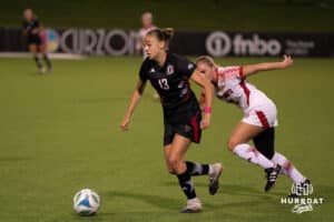 Omaha Maverick Blanche Brethes Vacchiani (13) dribbles the ball during a match against South Dakota on Thursday, October 23, 2025, in Omaha, Nebraska. Photo by Brandon Tiedemann.
