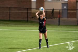 Omaha Maverick Maggie Gundersen (21) throws the ball in during a match against South Dakota on Thursday, October 23, 2025, in Omaha, Nebraska. Photo by Brandon Tiedemann.