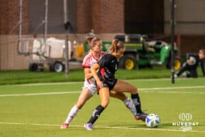 Omaha Maverick Lauren Schmidt (4) fights for the ball during a match against South Dakota on Thursday, October 23, 2025, in Omaha, Nebraska. Photo by Brandon Tiedemann.