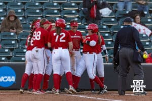Nebraska Cornhuskers Scarlet team celebrates Malia Thoms (4) two-run home run during Nebraska Red/White Game on Wednesday, October 22, 2025, in Lincoln, Nebraska. Photo by John S. Peterson.