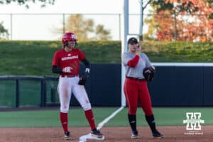 Nebraska Cornhusker Scarlet team Samantha Bland (29) and Nebraska Cornhusker Cream team Olivia DiNardo (1) standing at third base during Nebraska Red/White Game on Wednesday, October 22, 2025, in Lincoln, Nebraska. Photo by John S. Peterson.