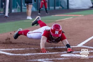 Nebraska Cornhusker Carlie Muhlbach (72) slides at home to score a run during Nebraska Red/White Game on Wednesday, October 22, 2025, in Lincoln, Nebraska. Photo by John S. Peterson.