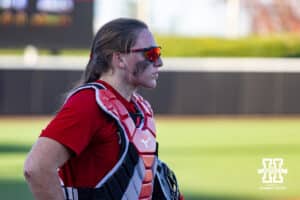 Nebraska Cornhusker Carlie Muhlbach (72) warming up to play catcher during Nebraska Red/White Game on Wednesday, October 22, 2025, in Lincoln, Nebraska. Photo by John S. Peterson.