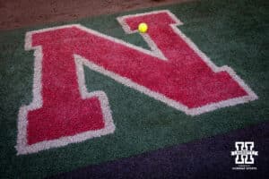 Nebraska "N" with a softball sitting on it while the team warms up during Nebraska Red/White Game on Wednesday, October 22, 2025, in Lincoln, Nebraska. Photo by John S. Peterson.