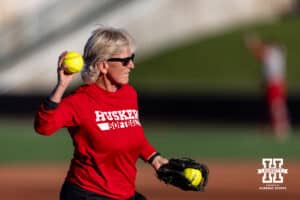 Nebraska head coach Rhonda Revelle throws the ball for warm ups during Nebraska Red/White Game on Wednesday, October 22, 2025, in Lincoln, Nebraska. Photo by John S. Peterson.