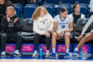 Creighton Bluejay Avery Cooper (#22) watches the game on the bench during an exhibition against Missouri Western on Wednesday, October 22, 2025, in Omaha, Nebraska. Photo by Brandon Tiedemann.