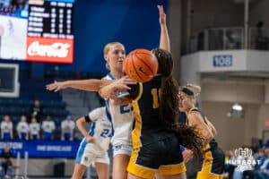 Creighton Bluejay Neleigh Gessert (#23) passes the ball behind an opponent during an exhibition against Missouri Western on Wednesday, October 22, 2025, in Omaha, Nebraska. Photo by Brandon Tiedemann.