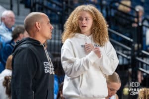 Creighton Bluejay Avery Cooper (#22) talks to a trainer during an exhibition against Missouri Western on Wednesday, October 22, 2025, in Omaha, Nebraska. Photo by Brandon Tiedemann.