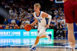 Creighton Bluejay Ty Davis dribbles the ball against the Iowa State Cyclones during a basketball game at CHI Health Arena on Friday, October 17, 2025, in Omaha, Nebraska. Photo by Collin Stilen.