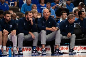 Creighton Bluejay coaches Alan Huss and Mitch Ballock talk alongside each other during a basketball game at CHI Health Arena on Friday, October 17, 2025, in Omaha, Nebraska. Photo by Collin Stilen.