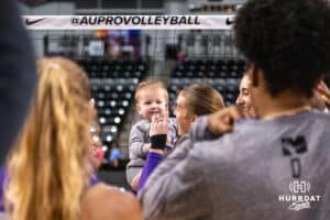 Team Hoffman Taylor Sandbothe (#41) celebrates a win with a child after the Athletes Unlimited Volleyball match against Team Hentz on Monday, October 13, 2025, in Omaha, Nebraska. Photo by Dawson Anderson.