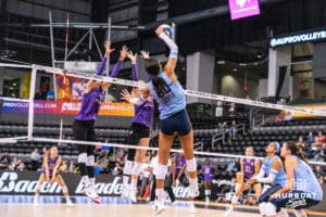 Team Hentz Reagan Cooper (#20) spikes the ball past Team Hoffman's block during the Athletes Unlimited Volleyball match against Team Hoffman on Monday, October 13, 2025, in Omaha, Nebraska. Photo by Dawson Anderson.