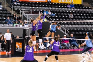 Team Hentz Reagan Cooper (#20) spikes the ball past Team Hoffman's block during the Athletes Unlimited Volleyball match against Team Hoffman on Monday, October 13, 2025, in Omaha, Nebraska. Photo by Dawson Anderson.