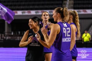 Team Hoffman Annayka Legros (#7) dances and laughs with teammate Gabby Blossom (#31) before the Athletes Unlimited Volleyball match against Team Hoffman on Monday, October 13, 2025, in Omaha, Nebraska. Photo by Dawson Anderson.