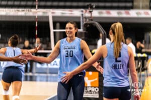 Team Hentz Sarah Parsons (#30) high fives teammate Sydney Hilley (#2) before the Athletes Unlimited Volleyball match against Team Hoffman on Monday, October 13, 2025, in Omaha, Nebraska. Photo by Dawson Anderson.