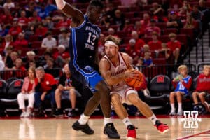 Nebraska's Sam Hoiberg (1) moves around the baseline against BYU's Keba Kita (13) during a college basketball game, Saturday, October 18th, 2025, Lincoln, Nebraska. Photo by Braden Cochran.