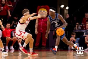 BYU's AJ Dybansta (3) tries to make a move around Nebraska's Sam Hoiberg (1) during a college basketball game, Saturday, October 18th, 2025, Lincoln, Nebraska. Photo by Braden Cochran.
