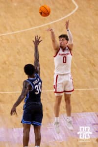 Nebraska guard Connor Essegian (0) hits a three pointer on a BYU defender during a college basketball game, Saturday, October 18th, 2025, Lincoln, Nebraska. Photo by Braden Cochran.
