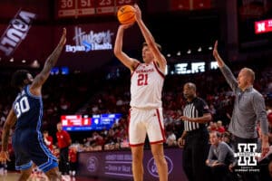 Nebraska junior Pryce Sandfort (21) takes a shot at a three in front of the BYU bench during a college basketball game, Saturday, October 18th, 2025, Lincoln, Nebraska. Photo by Braden Cochran.
