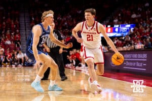 Nebraska junior Pryce Sandfort (21) dribbles the ball against BYU during a college basketball game on Saturday, October 18, 2025, in Lincoln, Nebraska. Photo by Braden Cochran.