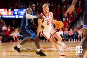 Nebraska Senior Rienk Mast (51) tries to make a move around a Birmingham Young defender during a college basketball game, Saturday, October 18th, 2025, Lincoln, Nebraska. Photo by Braden Cochran.