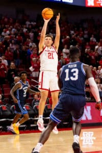 Nebraska Cornhusker forward Pryce Sandfort (21) takes a shot at a long two-pointer during a college basketball game on Saturday, October 18, 2025, in Lincoln, Nebraska. Photo by Braden Cochran.
