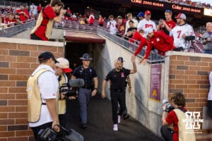 Nebraska Cornhusker head coach Matt Rhule gives some fans a high five walking out to the field during a college football game against the Minnesota Golden Gophers on Friday, October 17, 2025, in Minneapolis, Minnesota. Photo by John S. Peterson.