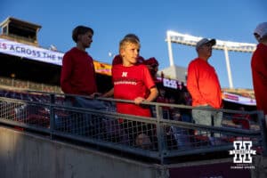 Nebraska Cornhuskers fan watching warm-ups before the college football game against the Minnesota Golden Gophers on Friday, October 17, 2025, in St. Paul, Minnesota. Photo by John S. Peterson.