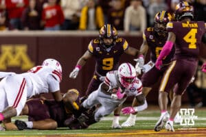 Nebraska Cornhusker running back Emmett Johnson (21) dives for extra yards against the Minnesota Golden Gophers during a college football game on Friday, October 17, 2025, in Minneapolis, Minnesota. Photo by John S. Peterson.