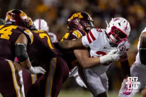 Nebraska Cornhusker linebacker Marques Watson-Trent (33) reaches for Minnesota Golden Gopher running back Fame Ijeboi (7) during a college football game on Friday, October 17, 2025, in Minneapolis, Minnesota. Photo by John S. Peterson.