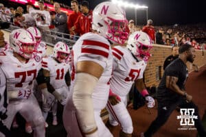 Nebraska Cornhuskers run out on the field to take on the Minnesota Golden Gophers during a college football game on Friday, October 17, 2025, in Minneapolis, Minnesota. Photo by John S. Peterson.