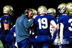 Elkhorn South's Jayden Sutko (19) is getting coached up while in a team huddle during a high school football game vs Westside on Friday, October 10, 2025, in Omaha, Nebraska. Photo By Jack R. Stephens.