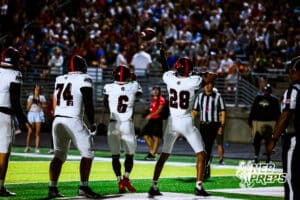 Westsides Ahmad Rustamov (74), TayTay Jenkins (6), and Bryson Williams (28) are celebrating after scoring a rushing touchdown during a high school football game @ Elkhorn South on Friday, October 10, 2025, in Omaha, Nebraska. Photo By Jack R. Stephens.