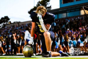 Elkhorn South's Nathan Zehr (5) praying before a high school football game VS Westside on Friday, October 10, 2025, in Omaha, Nebraska. Photo By Jack R. Stephens.