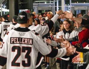Omaha Maverick Maxime Pellerin (23) and the team high fives fans after winning a college hockey game against Minnesota State on Friday, October 10, 2025, in Omaha, Nebraska. Photo by Dawson Anderson.
