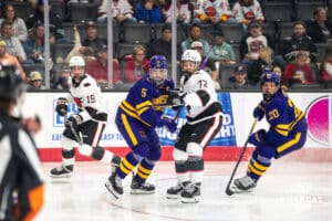 Omaha Maverick Marcus Nguyen (72) guards Minnesota State Maverick Mason Wheeler (5) during a college hockey game on Friday, October 10, 2025, in Omaha, Nebraska. Photo by Dawson Anderson.