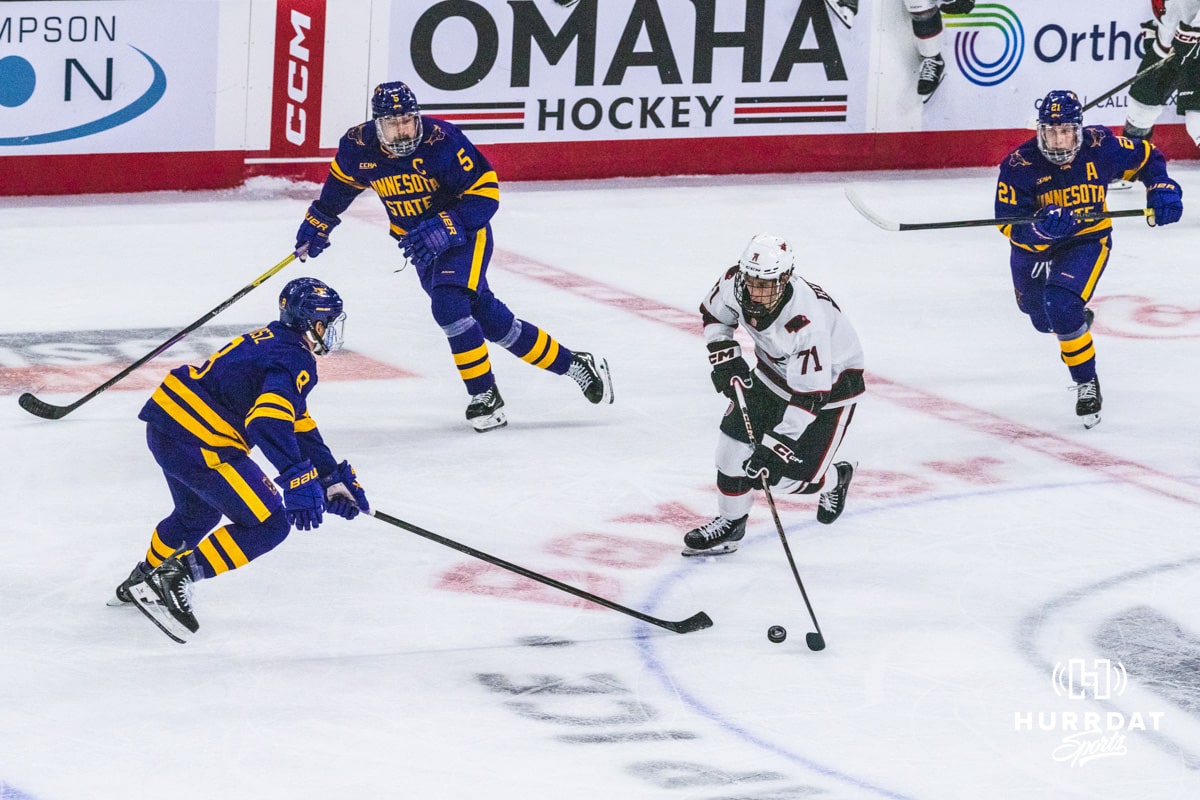 Omaha Maverick Brett Hyland (71) handles the pick at center ice during a college hockey game against Minnesota State on Friday, October 10, 2025, in Omaha, Nebraska. Photo by Dawson Anderson.