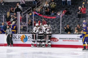 The Omaha Mavericks celebrates their first official goal of the season and Marcus Nguyen's (72) career first during the first period of a college hockey game against Minnesota State on Friday, October 10, 2025, in Omaha, Nebraska. Photo by Dawson Anderson.