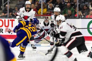 Omaha Maverick Simon Latkoczy (30) prepares to block a shot by Minnesota State Maverick Alex Zetterberg (12) during a college hockey game on Friday, October 10, 2025, in Omaha, Nebraska. Photo by Dawson Anderson.