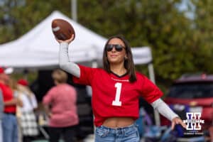 Tailgating Nebraska Cornhusker fans throwing the football before the college football game against the Maryland Terrapins on Saturday, October 11, 2025, in College Park, MD. Photo by John S. Peterson.