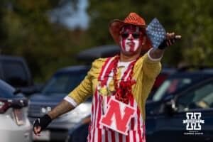 Nebraska Cornhuskers fan playing cornhole before the college football game against the Maryland Terrapins on Saturday, October 11, 2025, in College Park, MD. Photo by John S. Peterson.