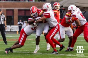 Nebraska Cornhusker linebacker Javin Wright (0) and linebacker Marques Watson-Trent (33) tackles Maryland Terrapin running back Dejuan Williams (0) during a college football game on Saturday, October 11, 2025, in College Park, MD. Photo by John S. Peterson.