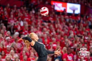 Nebraska Cornhusker Olivia Mauch (#10) serves during a college volleyball match against Washington on Friday, October 10, 2025, in Lincoln, Nebraska. Photo by Brandon Tiedemann.