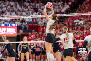 Nebraska Cornhusker Bergen Reilly (#2) sets the ball during a college volleyball match against Washington on Friday, October 10, 2025, in Lincoln, Nebraska. Photo by Brandon Tiedemann.