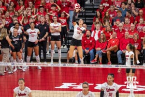Nebraska Cornhusker Andi Jackson (#15) serves during a college volleyball match against Washington on Friday, October 10, 2025, in Lincoln, Nebraska. Photo by Brandon Tiedemann.