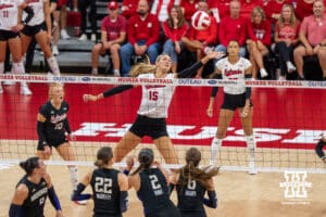 Nebraska Cornhusker Andi Jackson (#15) tips the ball during a college volleyball match against Washington on Friday, October 10, 2025, in Lincoln, Nebraska. Photo by Brandon Tiedemann.