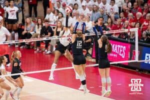 Nebraska Cornhusker Harper Murray (#27) spikes the ball during a college volleyball match against Washington on Friday, October 10, 2025, in Lincoln, Nebraska. Photo by Brandon Tiedemann.