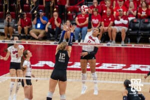 Nebraska Cornhusker Teraya Sigler (#11) jumps for the ball during a college volleyball match against Washington on Friday, October 10, 2025, in Lincoln, Nebraska. Photo by Brandon Tiedemann.